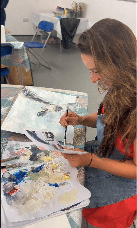 Students painting in class