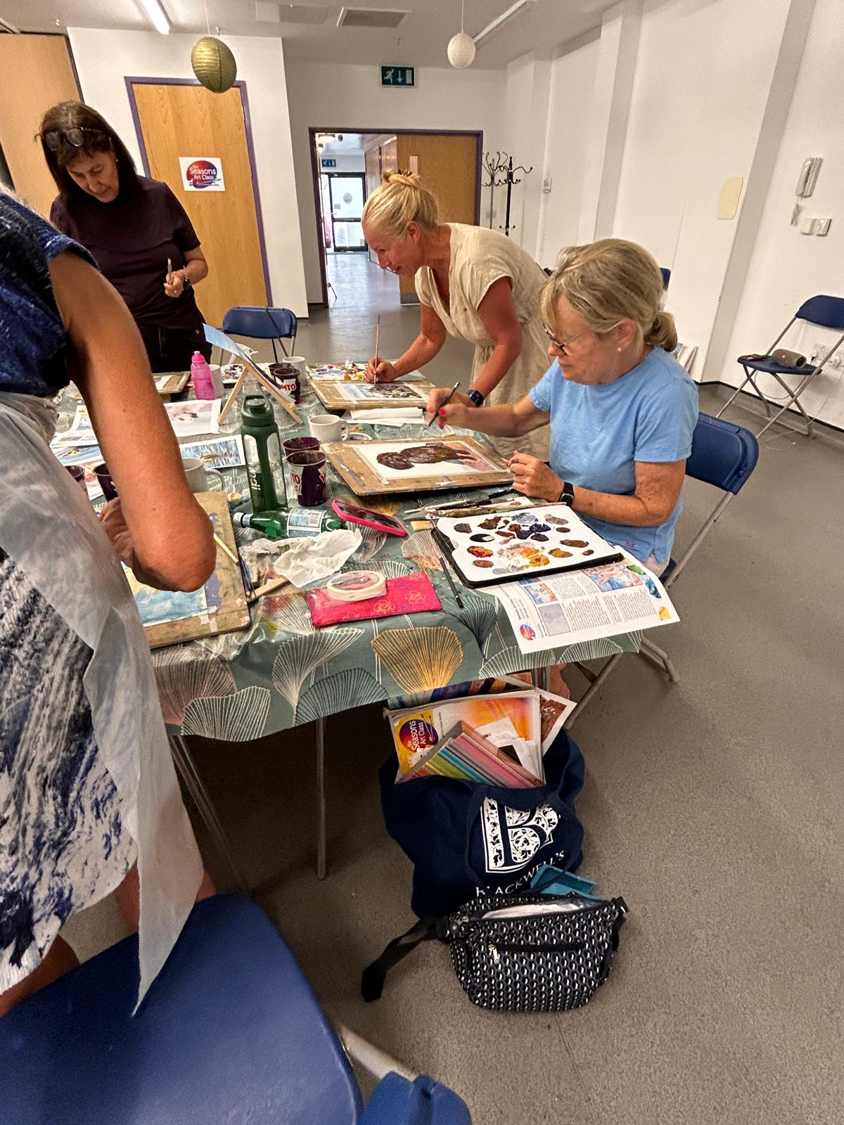 Students painting in class