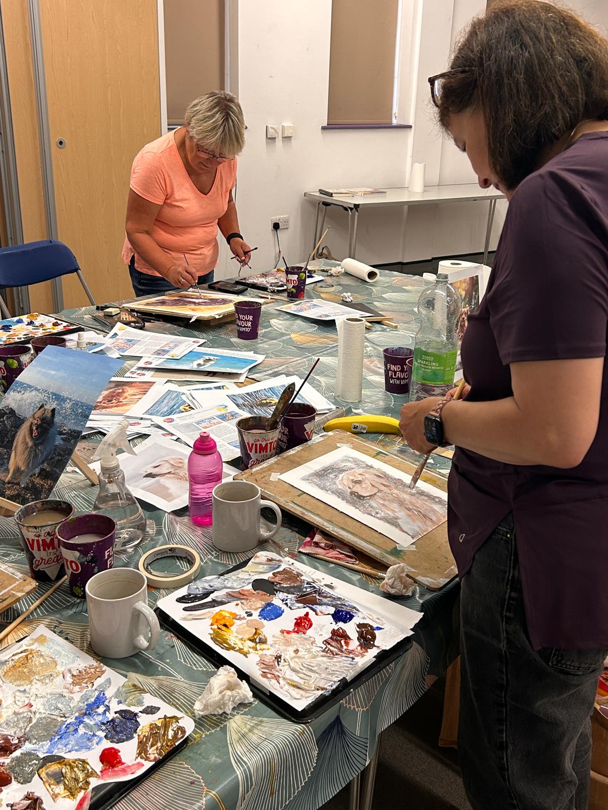 Students painting in class